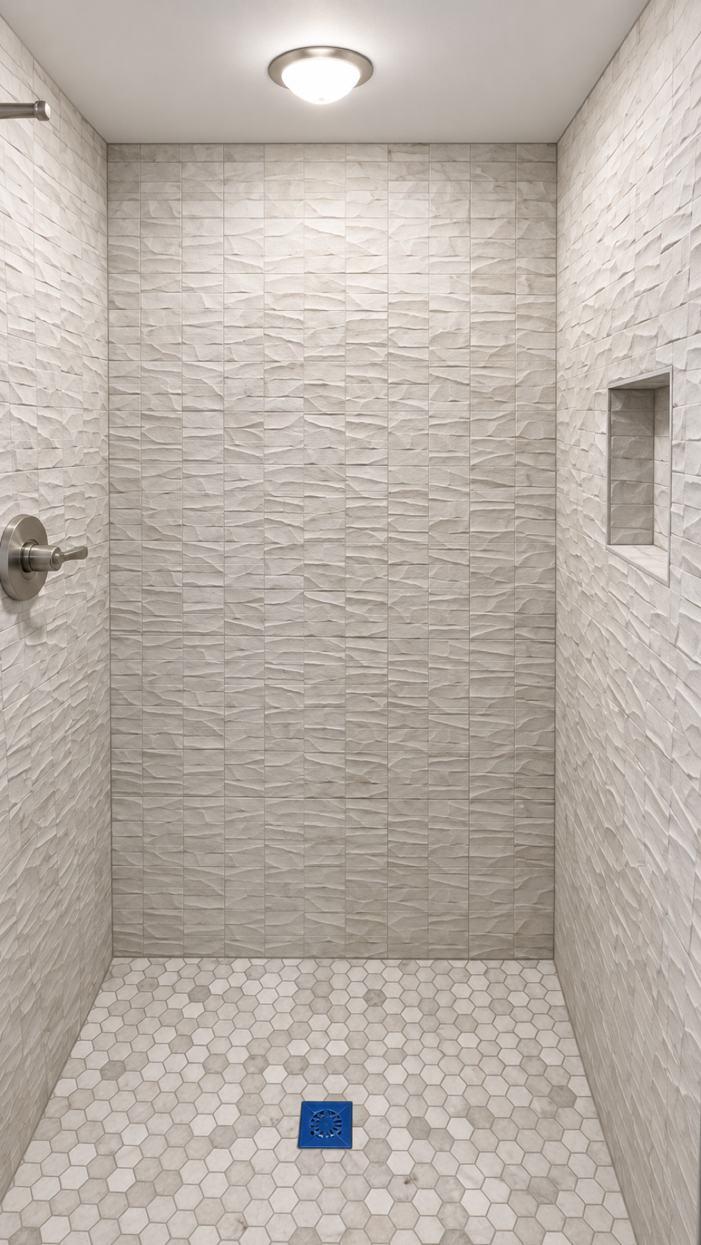 Textured stone look tile shower with hexagon marble floor